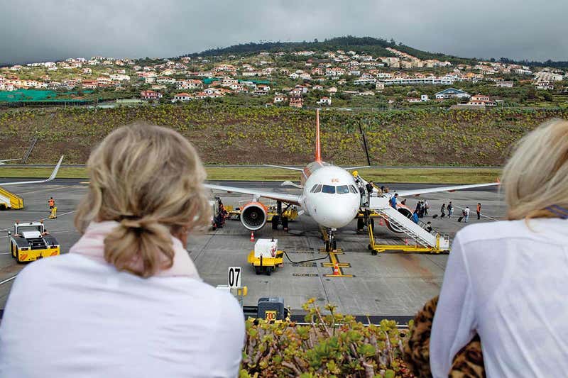 People getting off plane